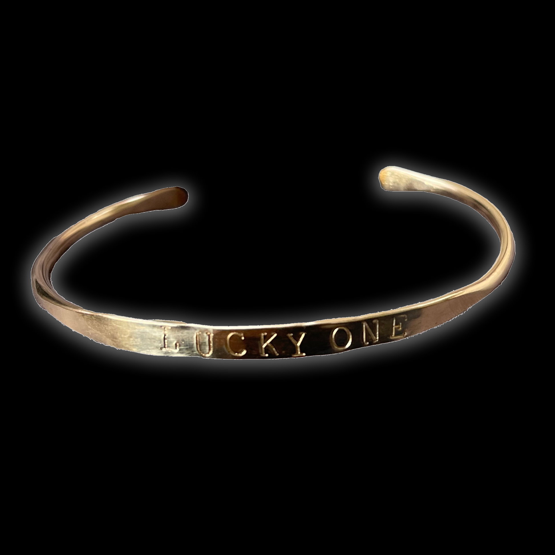 bracelet with Lucky One engraved on black